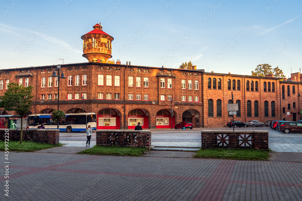 Katowice, Silesia, Poland; September 29, 2021: View on central square (plac Wyzwolenia) in historical district Nikiszowiec in the morning light. Old, brick buildings.