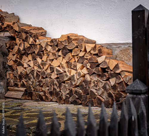 Stacked firewood near the w...
