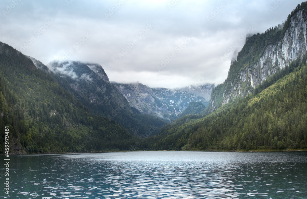 Lake in the mountains with cloudy peaks, and green forest, Alp, Upper Austria, Salzkammergut
