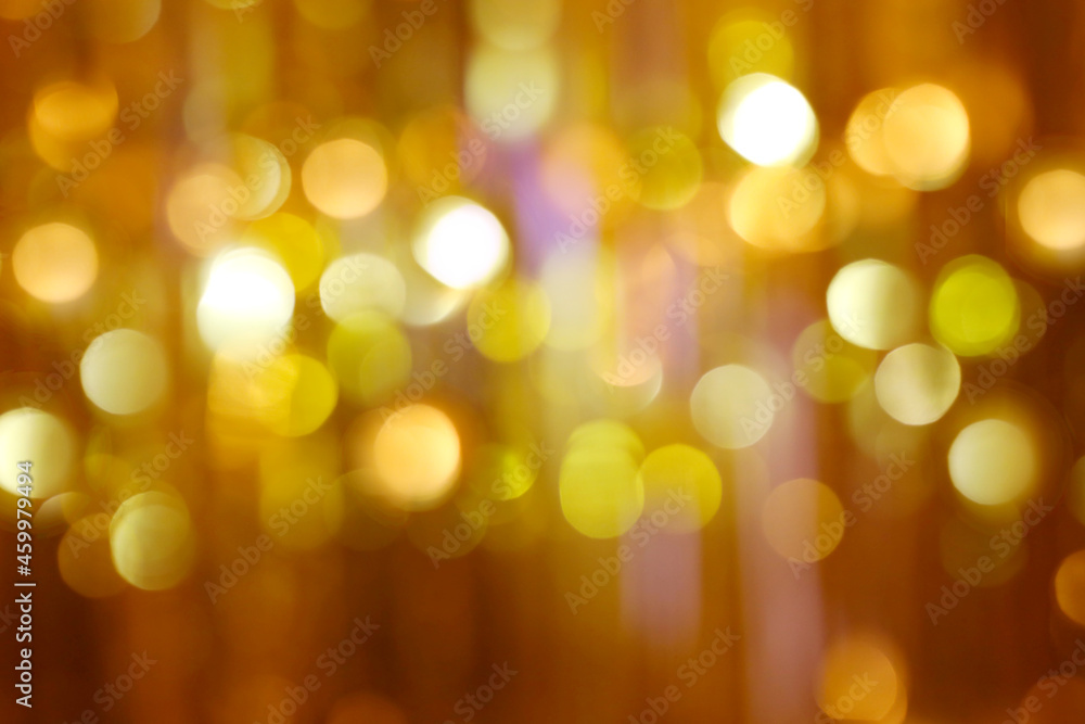 Abstract Christmas blurred background of golden Bokeh glitter