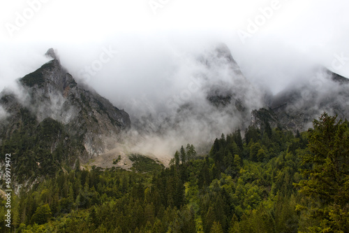 Misty mountain landscape with mountains and clouds in the Alps, Austria
