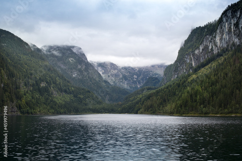 Lake in the mountains with cloudy peaks, and green forest, Alp, Upper Austria, Salzkammergut