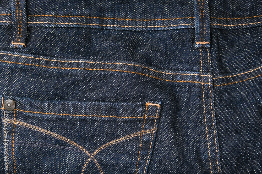 Dark blue jeans, denim back pockets close up Dark blue jeans, denim back pockets close up