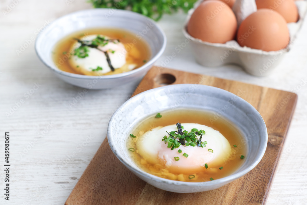 Bowls of traditional Japanese hot spring egg (Onsen Tamago) method of boiling eggs in the hot springs of Japan. Taste like soft custard, mostly famous during summer Bowls of traditional Japanese hot spring egg (Onsen Tamago) method of boiling eggs in the hot springs of Japan. Taste like soft custard, mostly famous during summer