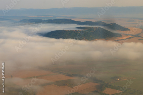 Aerial view of the mountains and fields in Bulgaria. View from a plane