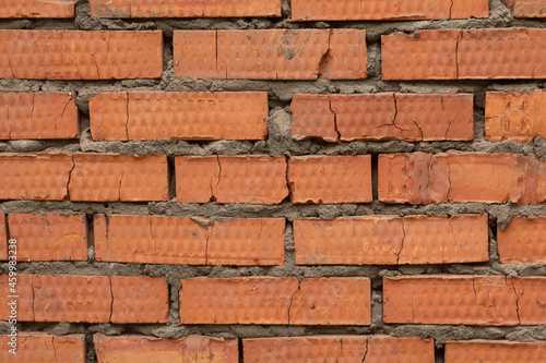 Red bricks texture cracked broken stones brick-wall