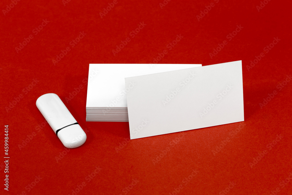 usb flash drive and business card on red mockup usb flash drive and business card on red mockup