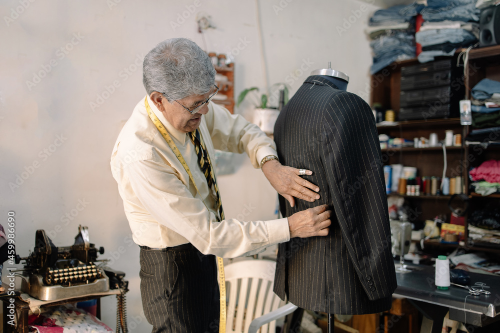 experienced mexican tailor working on local business experienced mexican tailor working on local business