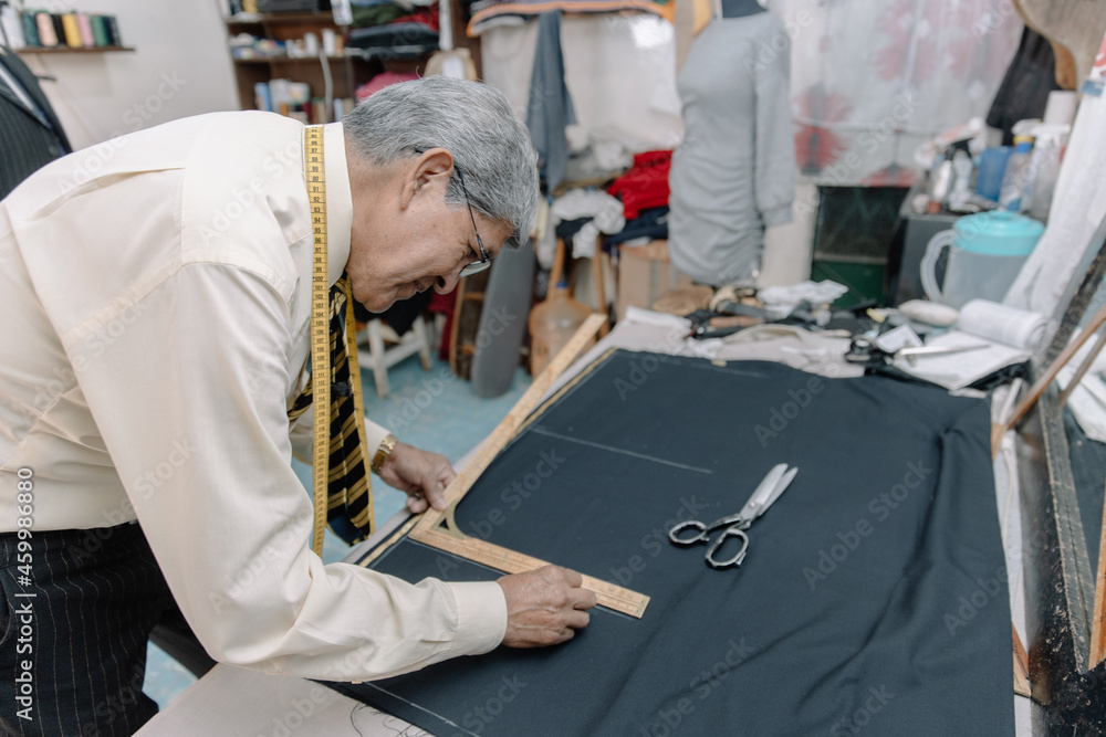 experienced mexican tailor making strokes on fabric experienced mexican tailor making strokes on fabric