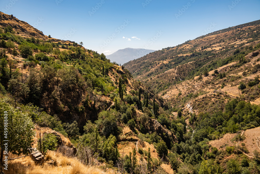 The beautiful landscape of the Poqueira Valley seen from a hiking trail near Capileira, Las Alpujarras, Sierra Nevada National Park, Andalusia, Spain