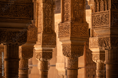 Arches and columns decorated with moorish ornaments at the Palace of the Lions (Palacio de los Leones), Hall of the Mocarabes, Nasrid palaces, Alhambra de Granada UNESCO World Heritage Site, Spain
