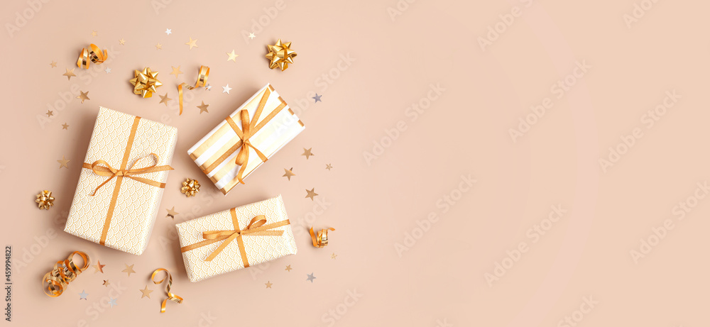 Christmas background with gift boxes wrapped in golden colored paper. Xristmas celebration, preparation for winter holidays. Festive mockup, top view, flat lay - obrazy, fototapety, plakaty 