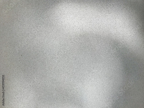 Gray textured surface, wall covered with plaster.