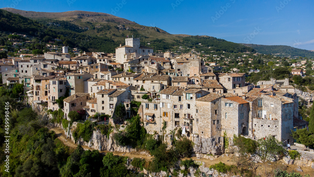 Aerial view of the medieval village of Tourrettes sur Loup in the mountains above Nice on the French Riviera, France - Old stone houses nestled on a belvedere in Provence