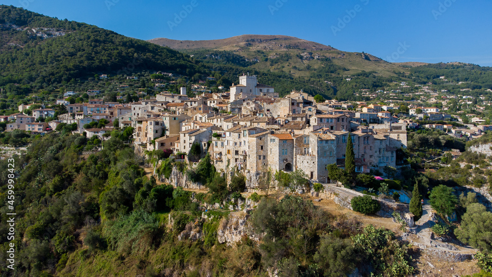 Aerial view of the medieval village of Tourrettes sur Loup in the mountains above Nice on the French Riviera, France - Old stone houses nestled on a belvedere in Provence