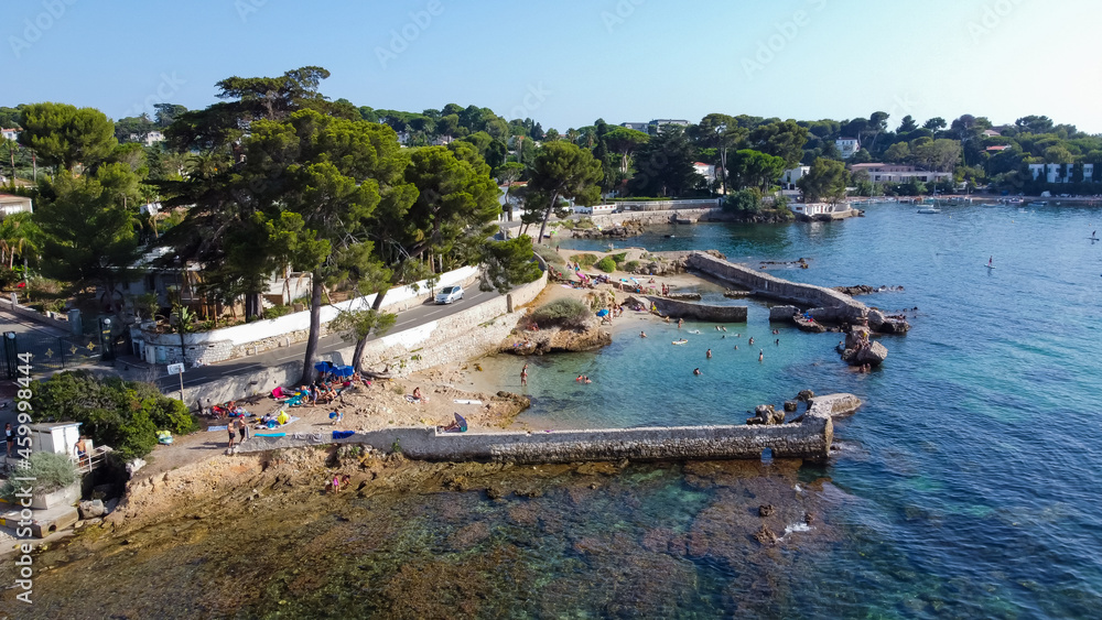 Aerial view of a collapsed wall between Ondes Beach and Mallet Beach on the Cap d'Antibes in the French Riviera - Natural pool created by the ruins of a breakwater in the Mediterranean Sea