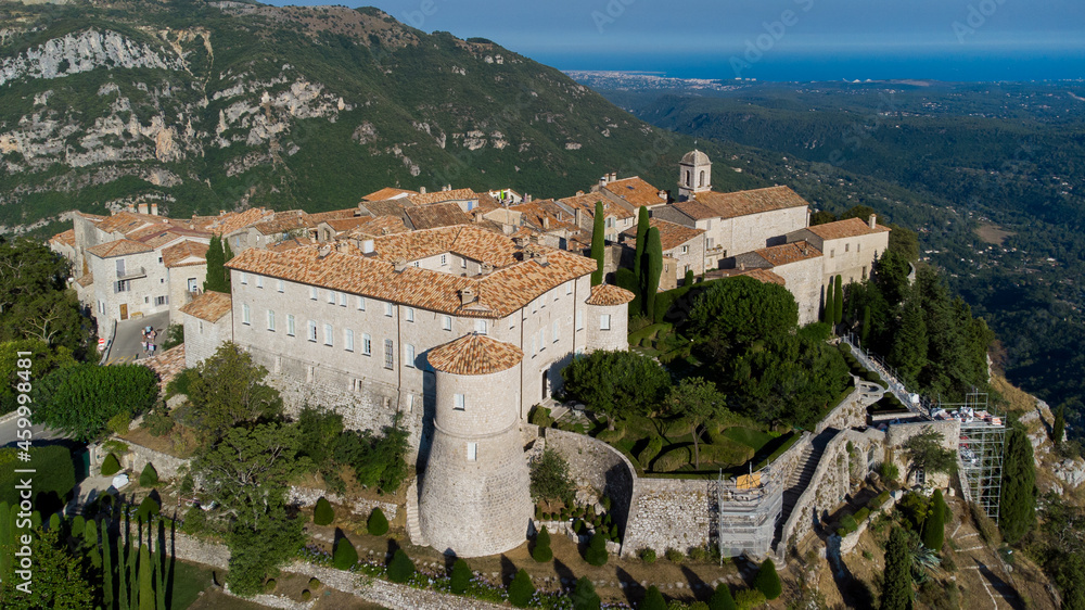 Aerial view of the medieval village of Gourdon in Provence, France - Castle with a round tower built on the edge of a cliff in the mountains of the Gorges du Loup on the French Riviera