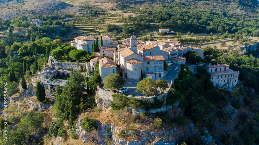 Aerial view of the medieval village of Gourdon in Provence, France - Stone church built on the edge of a cliff in the mountains of the Gorges du Loup on the French Riviera