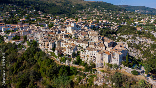 Aerial view of the medieval village of Tourrettes sur Loup in the mountains above Nice on the French Riviera, France - Old stone houses nestled on a belvedere in Provence