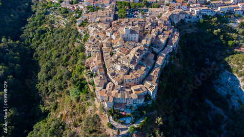 Aerial view of the horseshoe shaped narrow streets of  Tourrettes sur Loup, a stone village built on a promontory in the mountains above Nice on the French Riviera, France photo