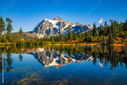 The iconic view of Mount Shuksan reflecting in Picture Lake during the Fall in the Pacific Northwest of the United States