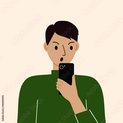 Angry man with mobile phone, front view. Taking pictures, reading, chatting. Smartphone and internet addiction.