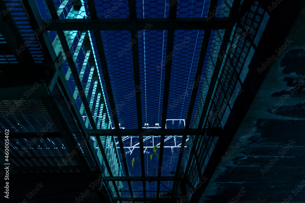 Obraz premium Railway bridge at night in Japan. View from underneath