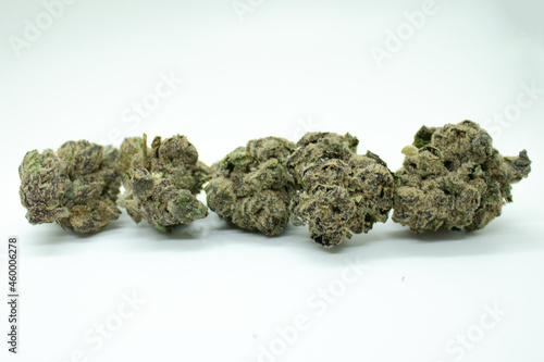 Cluster of Golden Goat and Blue Dream cannabis flower on a white background.