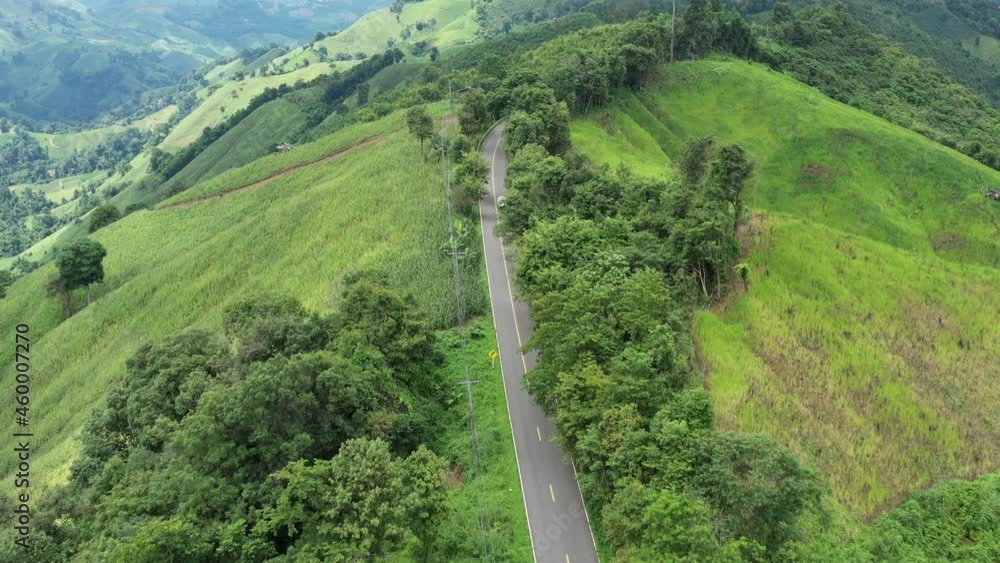 An aerial view of a beautiful road that passes on a mountain. rural areas of northern Thailand An aerial view of a beautiful road that passes on a mountain. rural areas of northern Thailand
