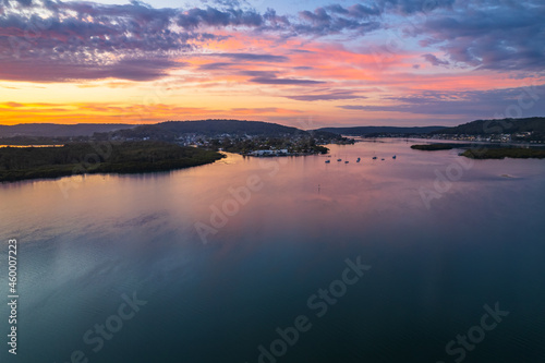 Sunrise waterscape and clouds with reflections