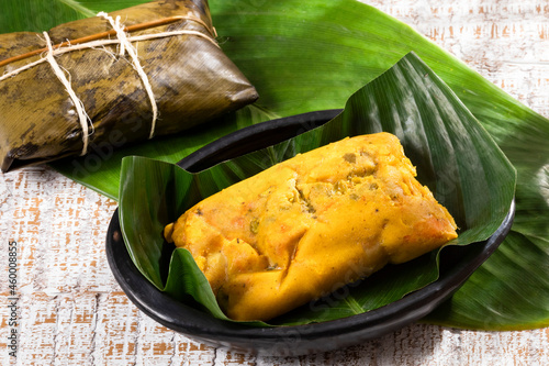 Tamale Typical Colombian Food Wrapped In Banana Leaves photo
