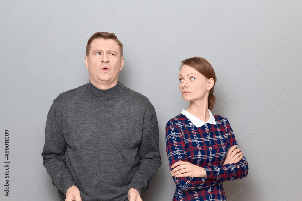 Portrait of couple after quarrel or unpleasant conversation Portrait of couple after quarrel or unpleasant conversation