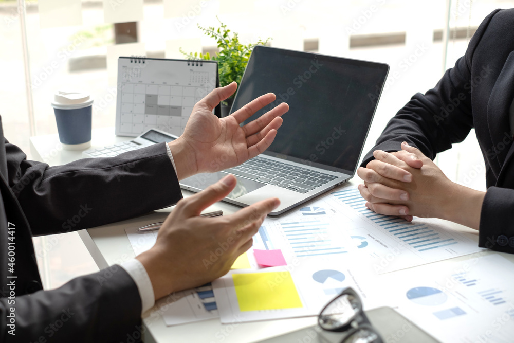 Business leaders talk about charts, financial graphs showing results are analyzing and calculating planning strategies, business success building processes Business leaders talk about charts, financial graphs showing results are analyzing and calculating planning strategies, business success building processes