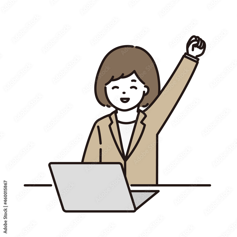 パソコンの前でガッツポーズをするビジネスウーマン