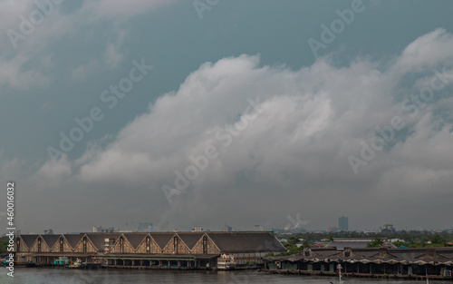 Bangkok, Thailand - 17 Jun 2020 : Dock buildings and Traditional warehouses on the Chao phraya riverfront. © num