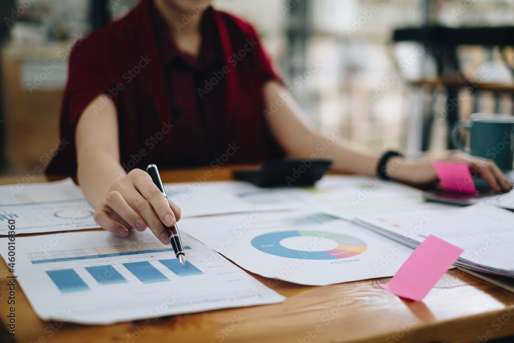 Close-up of a business woman audit the company's budget. Tax information is calculated by accountants. Close-up of a business woman audit the company's budget. Tax information is calculated by accountants.