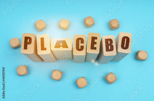 On a blue background, wooden cubes and Jenga with the inscription - PLACEBO photo