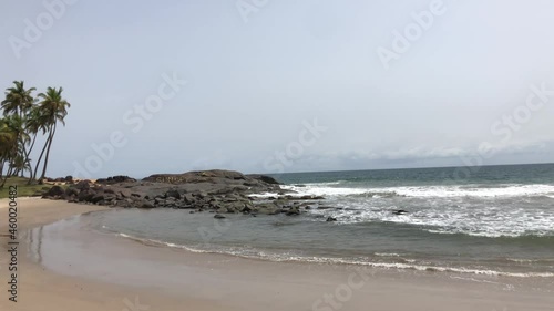 Handheld shot of beautiful and remote Sunset Beach near Buchanan, Liberia photo