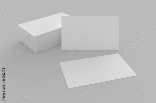 Business Cards or Name Cards textured in white and isolated on a grey surface background. 3d rendered illustration and graphic asset © Keith