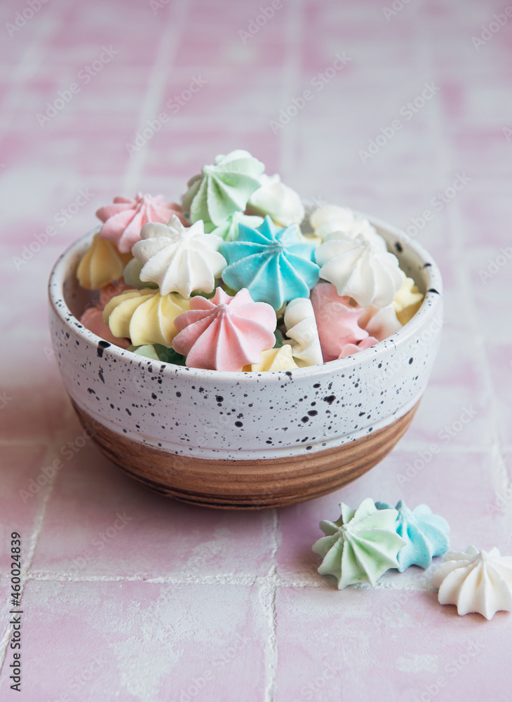 Small colorful meringues in the ceramic bowl Small colorful meringues in the ceramic bowl