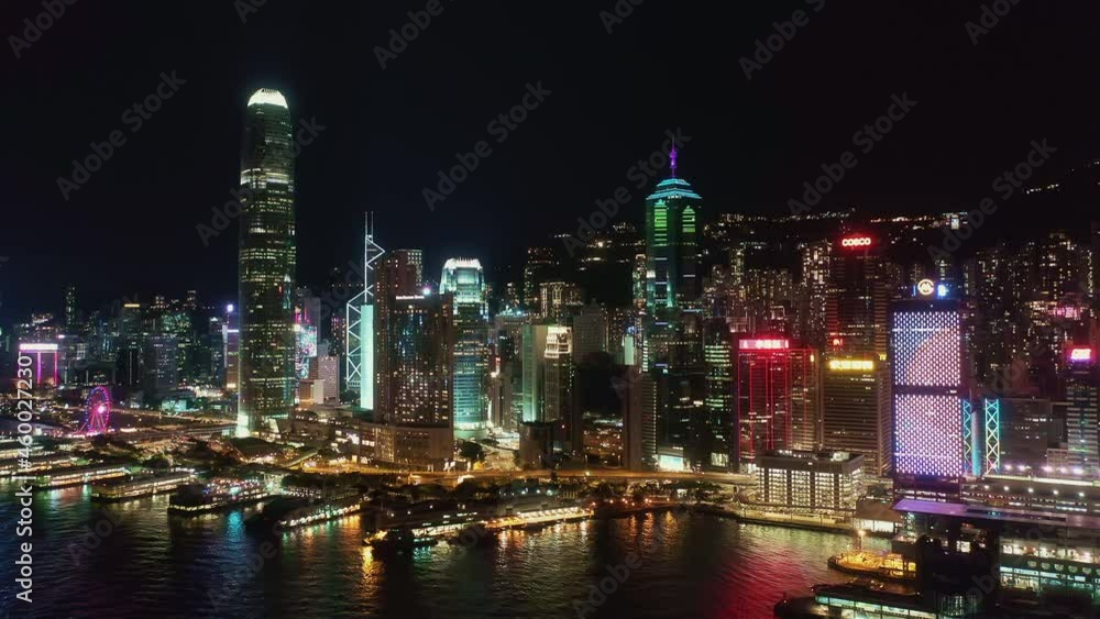 Hong Kong island skyline at night, central financial district. Aerial side pan left to right Hong Kong island skyline at night, central financial district. Aerial side pan left to right