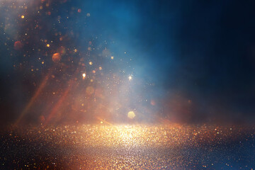 background of abstract glitter lights. gold, blue and black. de focused