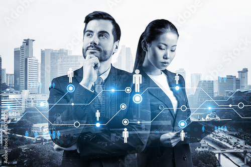 Photography Businessman and businesswoman as a SMM specialists thinking about development of social media marketing strategy to achieve business goals