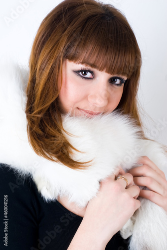 Young pretty woman wearing white fur over white