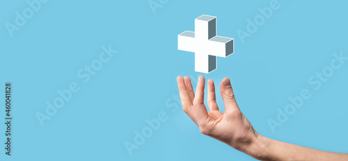 Fototapeta Naklejka Na Ścianę i Meble -  Hand hold 3D plus icon, man hold in hand offer positive thing such as profit, benefits, development, CSR represented by plus sign.The hand shows the plus sign