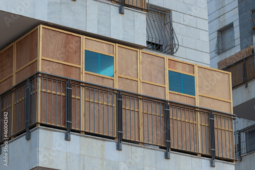 A wooden sukkah inside the balcony of a building, the Jewish holiday of Sukkot photo