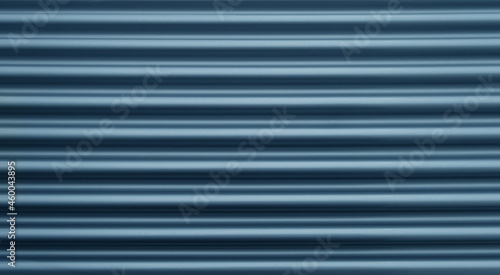 closeup of shiny new silver grey metallic blinds shutters  - copy space