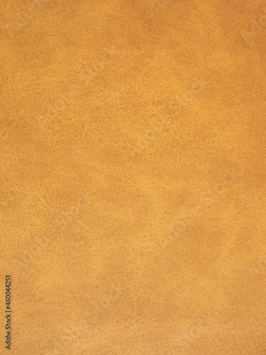 Suede surface in beige and mustard color as a background. High quality photo