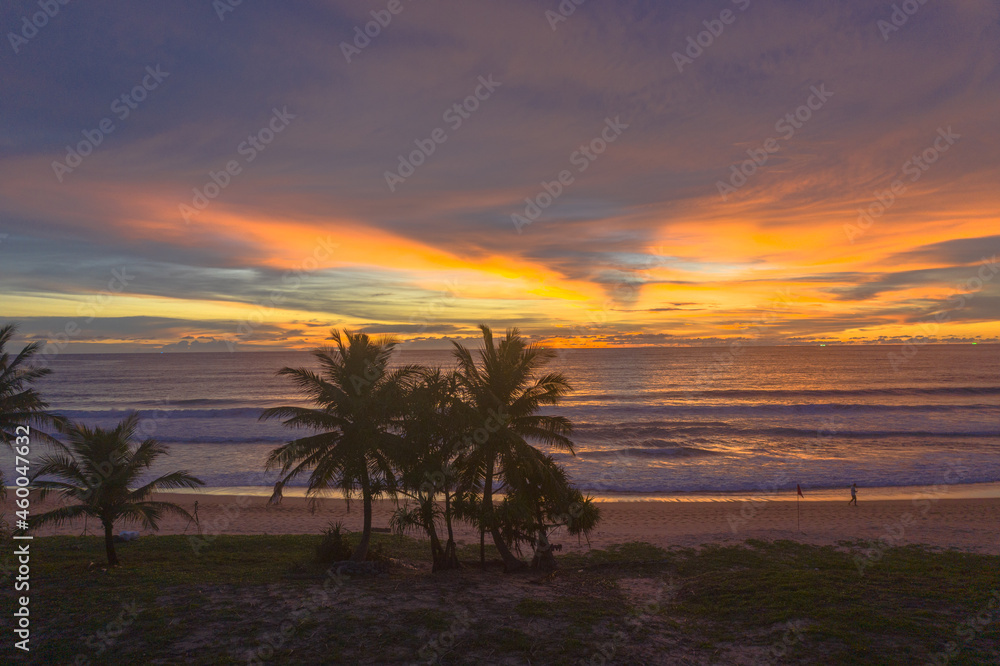 the colorful clouds are changing color in sky at sunset above the sea..Gradient color. Sky texture, abstract nature background..Sunset with strong color clouds at Karon beach Phuket.