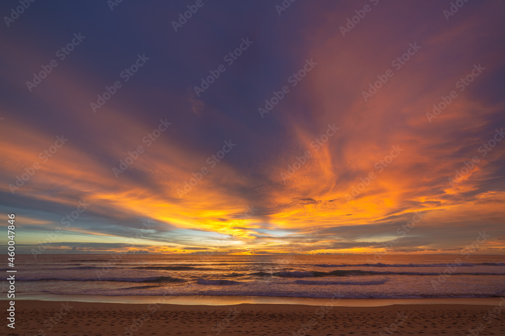 the colorful clouds are changing color in sky at sunset above the sea..Gradient color. Sky texture, abstract nature background..Sunset with strong color clouds at Karon beach Phuket.